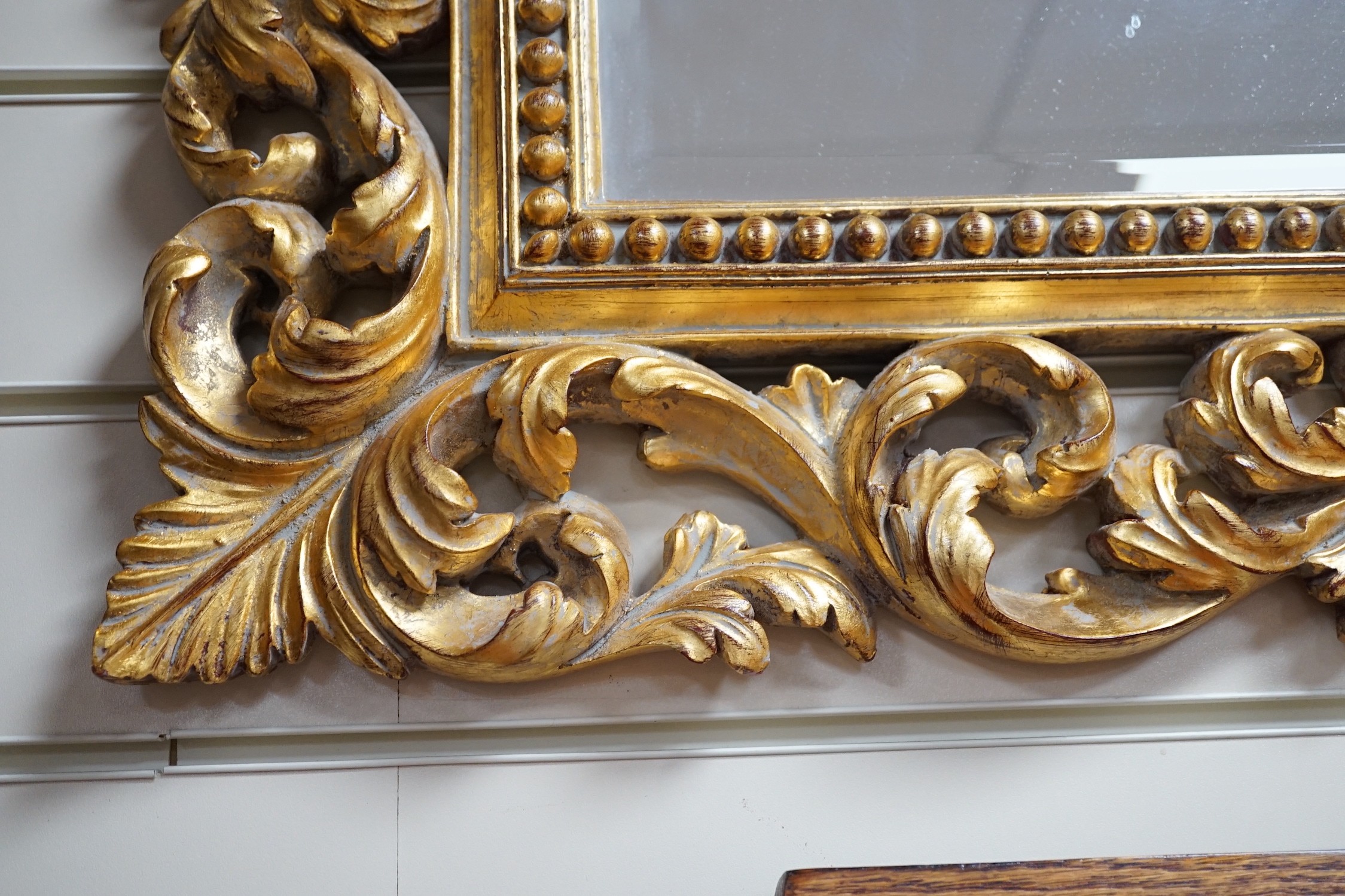 A Florentine giltwood wall mirror, width 98cm, height 77cm *Please note the sale commences at 9am.